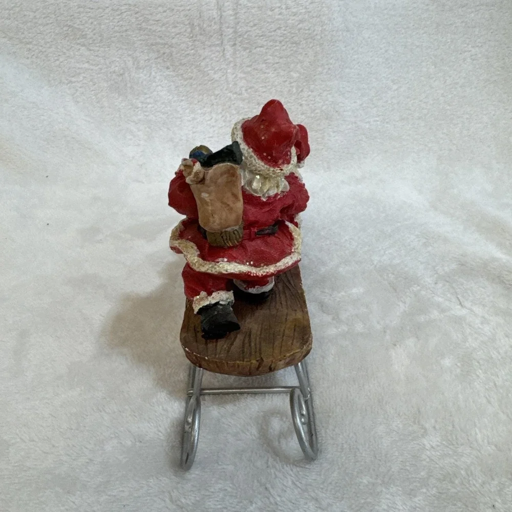 Three Jolly Santas Riding On a Sled‎ Christmas Figurine Vintage 90s